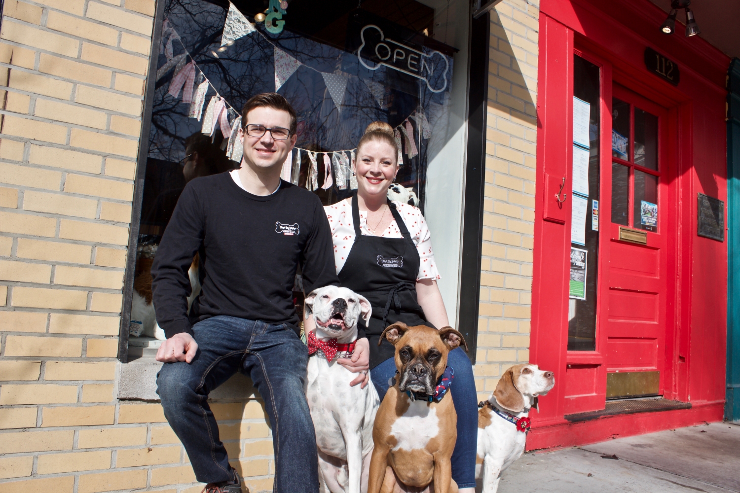 The owners of Three Dog Bakery with their canine counterparts.