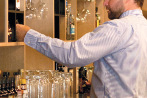 Owner Neal Brown tending bar. Owner Neal Brown Tending Bar