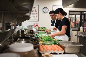 Chef Floyd (R) working at Fast and Furious Forks 2017. Chef Shelva Floyd